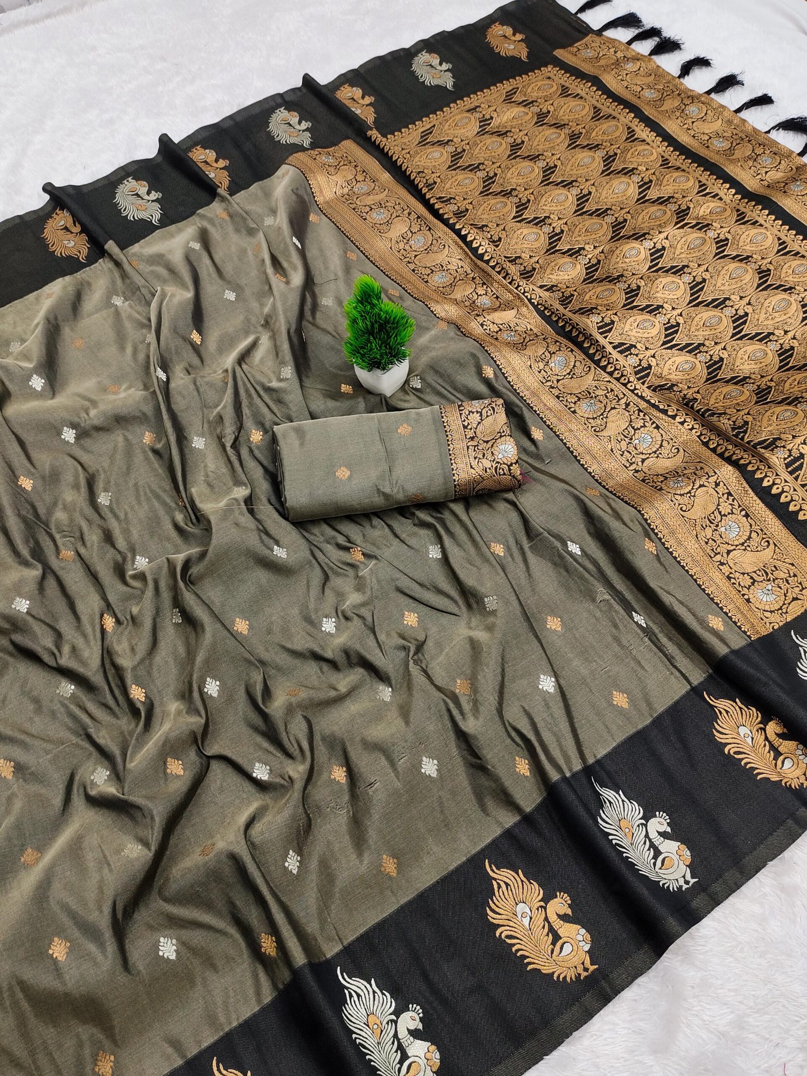 A Soft silk saree is weaved with Premium soft Silk fabric